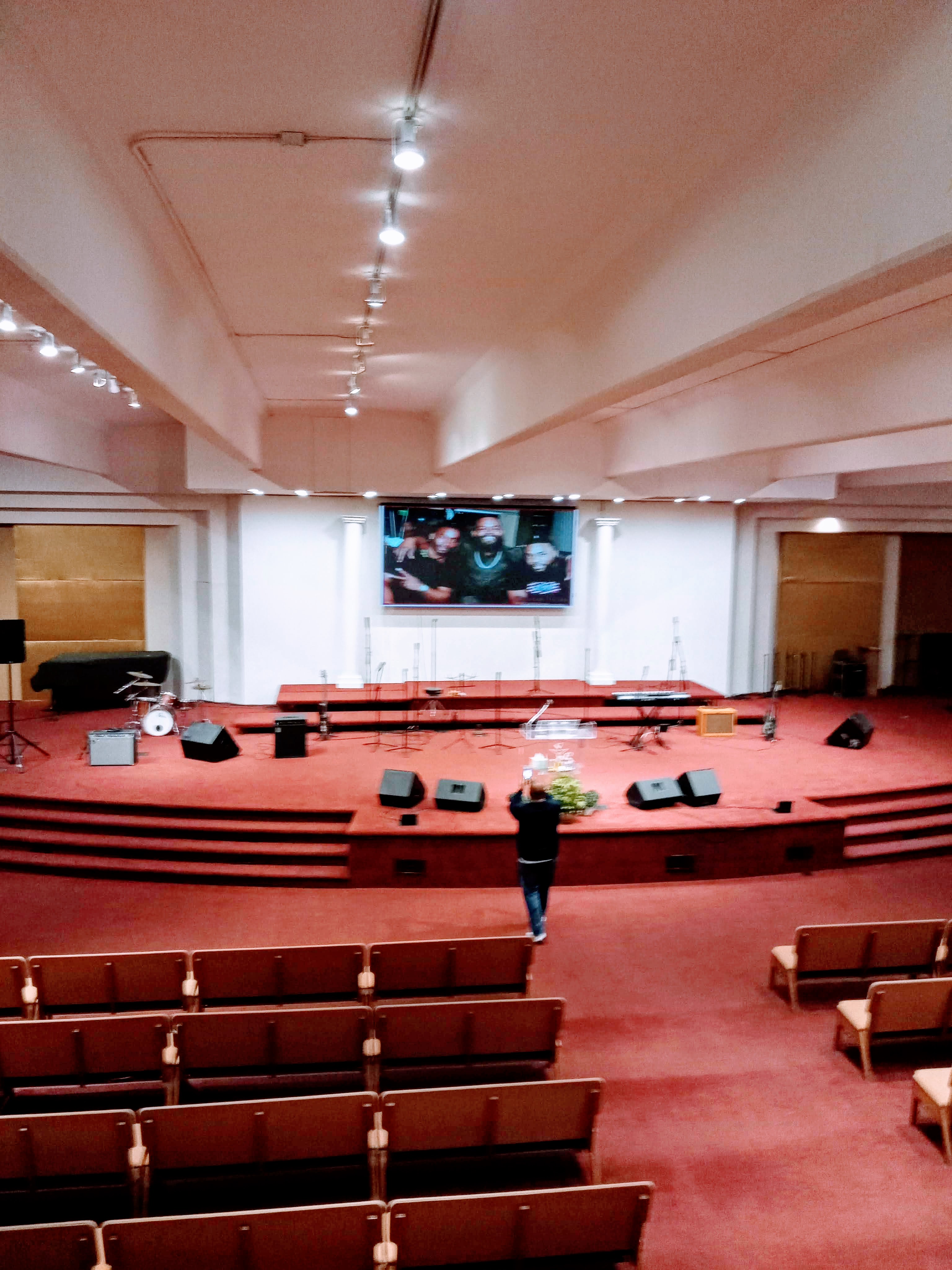 Digital signage in a church foyer with welcome message