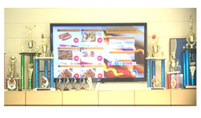 Digital menu board running on a wall-mounted TV